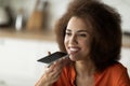 Portrait Of Smiling Young Black Woman Recording Voice Message On Smartphone Royalty Free Stock Photo