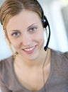 Portrait of smiling young blond teleoperator Royalty Free Stock Photo