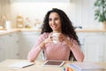 Portrait Of Smiling Brunette Freelancer Lady Enjoying Cup Of Coffee In Kitchen Royalty Free Stock Photo