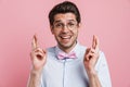 Portrait of a smiling young brunette nerd man