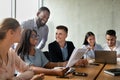 Portrait Of Smiling Young Business People Communicating During Corporate Meeting In Office Royalty Free Stock Photo