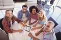 Portrait of smiling young business team sitting at desk Royalty Free Stock Photo