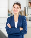 Smiling business woman with arms crossed in office Royalty Free Stock Photo