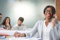 Portrait of smiling young business woman talking on mobile phone at office. Royalty Free Stock Photo