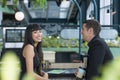 Portrait of a smiling young businessman and woman. Happy business people talking in Co Working space office Royalty Free Stock Photo