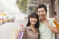 Portrait of smiling young couple at the bus stop, Beijing, China Royalty Free Stock Photo