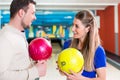 Couple holding bowling ball Royalty Free Stock Photo