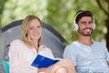 Portrait smiling young couple in tent