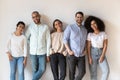 Portrait of smiling young diverse people standing in row Royalty Free Stock Photo