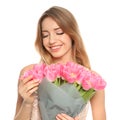 Portrait of smiling young girl with beautiful tulips on white background. Royalty Free Stock Photo