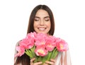 Portrait of smiling young girl with beautiful tulips on white background. Royalty Free Stock Photo