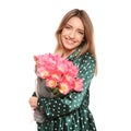 Portrait of smiling young girl with beautiful tulips on white background. Royalty Free Stock Photo