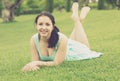 Portrait of smiling young girl while lying in outdoors Royalty Free Stock Photo