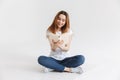 Portrait of a smiling young girl reading book Royalty Free Stock Photo