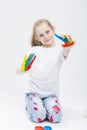 Portrait of Smiling Young Girl Showing Messy Colorful Hands Brightly Painted