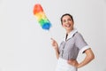 Portrait of a smiling young housemaid dressed in uniform Royalty Free Stock Photo