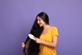 Young Indian Woman Brushing Long Hair With Wooden Comb Royalty Free Stock Photo
