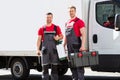 Portrait Of A Smiling Young Male Technicians Holding Tool Box Royalty Free Stock Photo