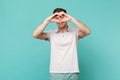 Portrait of smiling young man in casual clothes showing shape heart with hands isolated on blue turquoise wall Royalty Free Stock Photo