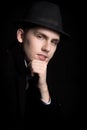 Portrait of smiling young man in hat and coat Royalty Free Stock Photo