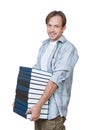 The portrait of smiling young man holding stack of books Royalty Free Stock Photo