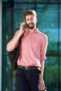 Smiling young man talking on mobile phone in city Royalty Free Stock Photo
