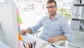 Portrait of a smiling young man using computer Royalty Free Stock Photo