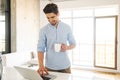 Portrait of a smiling young man using laptop computer Royalty Free Stock Photo