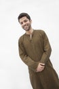 Portrait of smiling young man wearing traditional clothing from Pakistan, studio shot Royalty Free Stock Photo