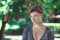 Portrait of smiling young middle aged white caucasian girl woman with short hair stylish haircut in tshirt looking away Royalty Free Stock Photo