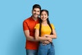 Portrait Of Smiling Young Middle Eastern Couple Embracing And Looking At Camera Royalty Free Stock Photo