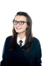 Portrait of smiling young schoolgirl looking away