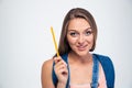 Portrait of a smiling young student holding pencil Royalty Free Stock Photo