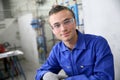 Portrait of smiling young trainee in plumbery Royalty Free Stock Photo