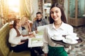 Portrait smiling young waitress standing in cafe Royalty Free Stock Photo