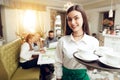 Portrait smiling young waitress standing in cafe Royalty Free Stock Photo