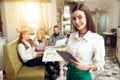 Portrait smiling young waitress standing in cafe Royalty Free Stock Photo