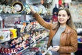 Woman shopping in souvenir store Royalty Free Stock Photo