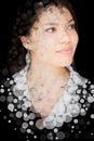 A portrait of a smiling young woman combined with translucent circles in a double exposure technique. Royalty Free Stock Photo