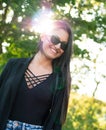 Portrait of smiling young woman with dark clothing