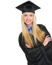 Portrait of smiling young woman in graduation gown Royalty Free Stock Photo
