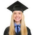 Portrait of smiling young woman in graduation gown Royalty Free Stock Photo