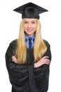 Portrait of smiling young woman in graduation gown Royalty Free Stock Photo