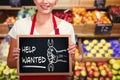 Composite image of portrait of smiling young woman holding chalkboard Royalty Free Stock Photo