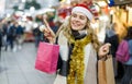 Woman holding bags with Christmas toys