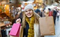 Woman holding bags with Christmas toys