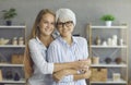 Portrait of a smiling young woman hugging her happy mature mother or grandmother Royalty Free Stock Photo