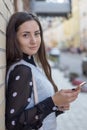 Portrait of smiling young woman with smart phone Royalty Free Stock Photo