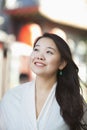 Portrait of Smiling Young Woman with Long Hair in Nanluoguxiang, Beijing Royalty Free Stock Photo