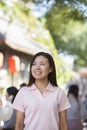 Portrait of Smiling Young Woman in Nanluoguxiang, Beijing Royalty Free Stock Photo